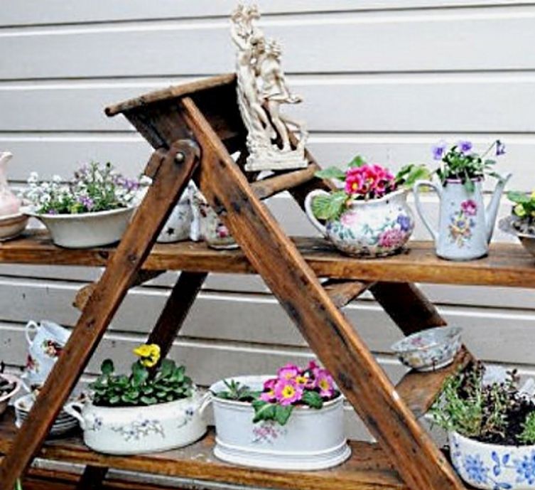 Ladders and other recycled frames and shelves can be used to support recycled pots, and dishes used to growth vegetables